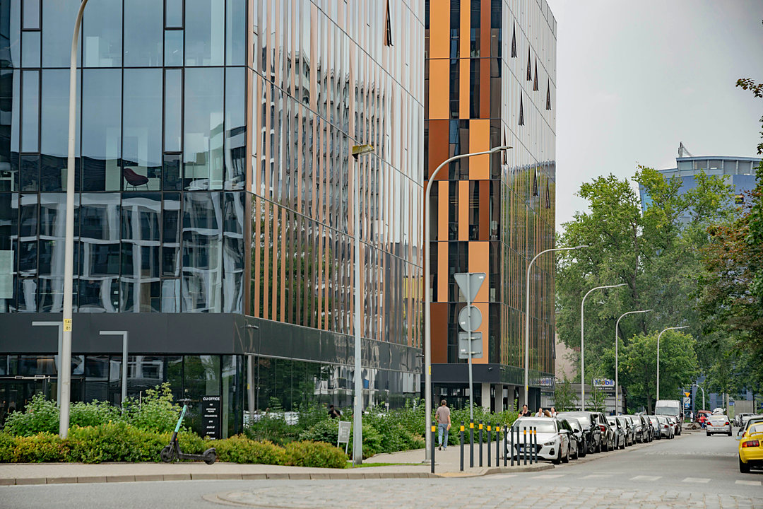 Modern office campus along a landscaped street