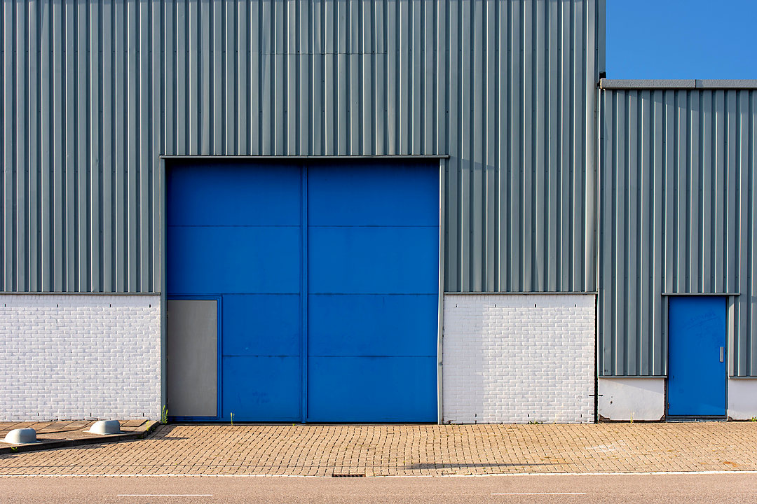 Industrial warehouse facade with a large loading door